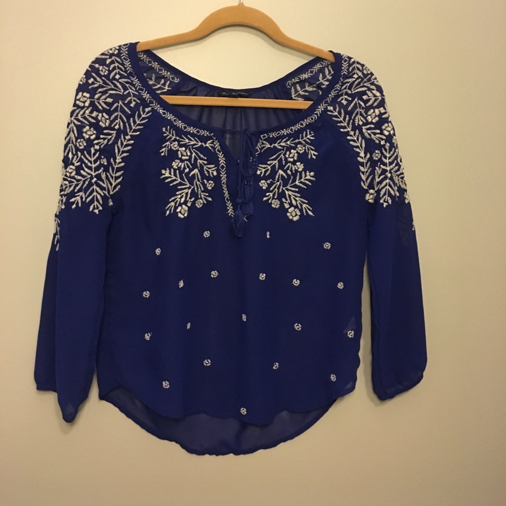 Royal blue blouse with white detailing